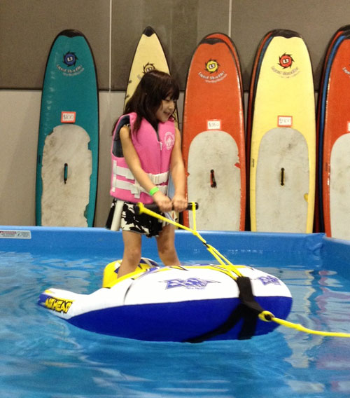 Girl-on-Inflatable-la-boat-show