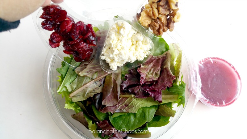 Assembling the elevAte Salad available at Costco