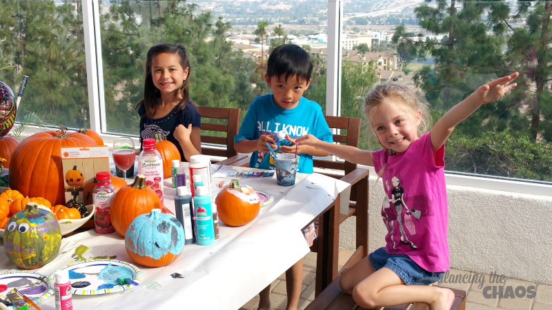 painting pumpkins with friends