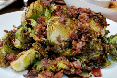 Sautéed brussel sprouts topped with boysenberry balsamic and bacon